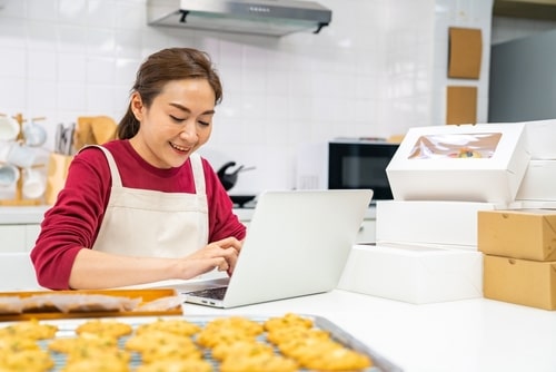 starting home-based food business in New York, woman with baked goods