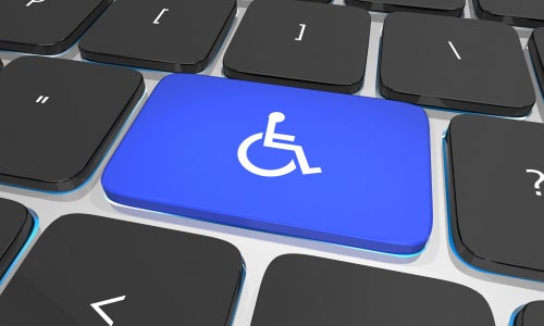 Disability wheelchair symbol on keyboard, website ADA rules concept