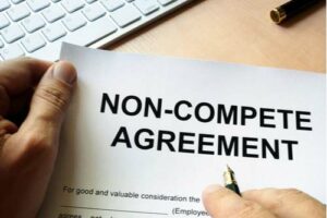 An employee signing a non-compete agreement