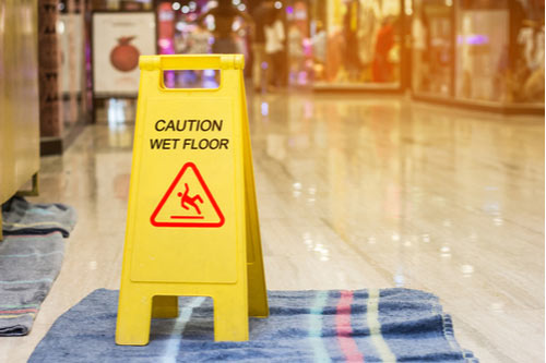 wet floor sign, premises liability defenses concept