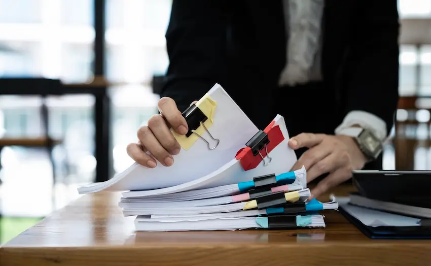 Lawyer examining electronically signed contracts and legal documents in law office