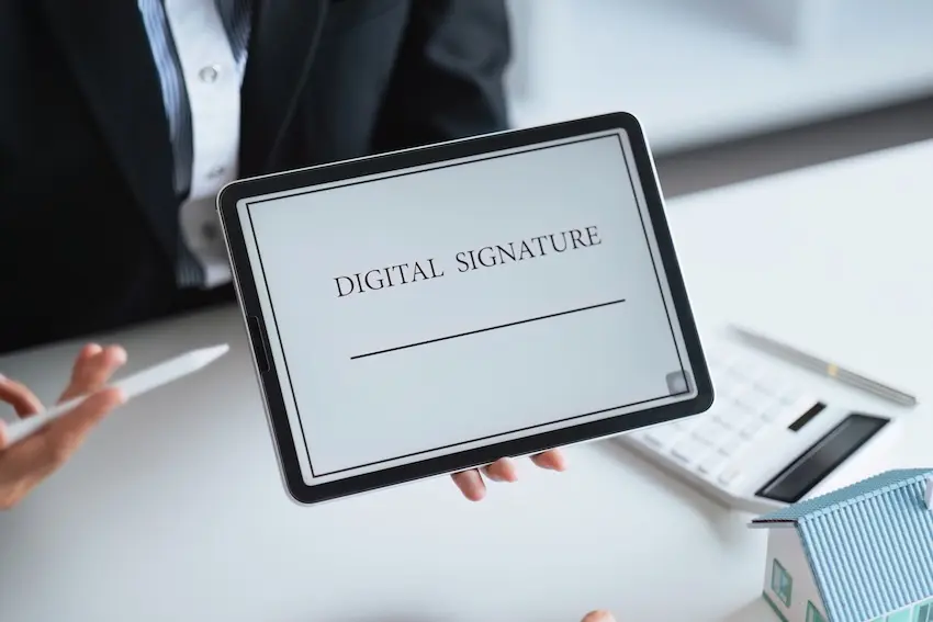Close-up of digital document showing electronic signatures with security verification icons